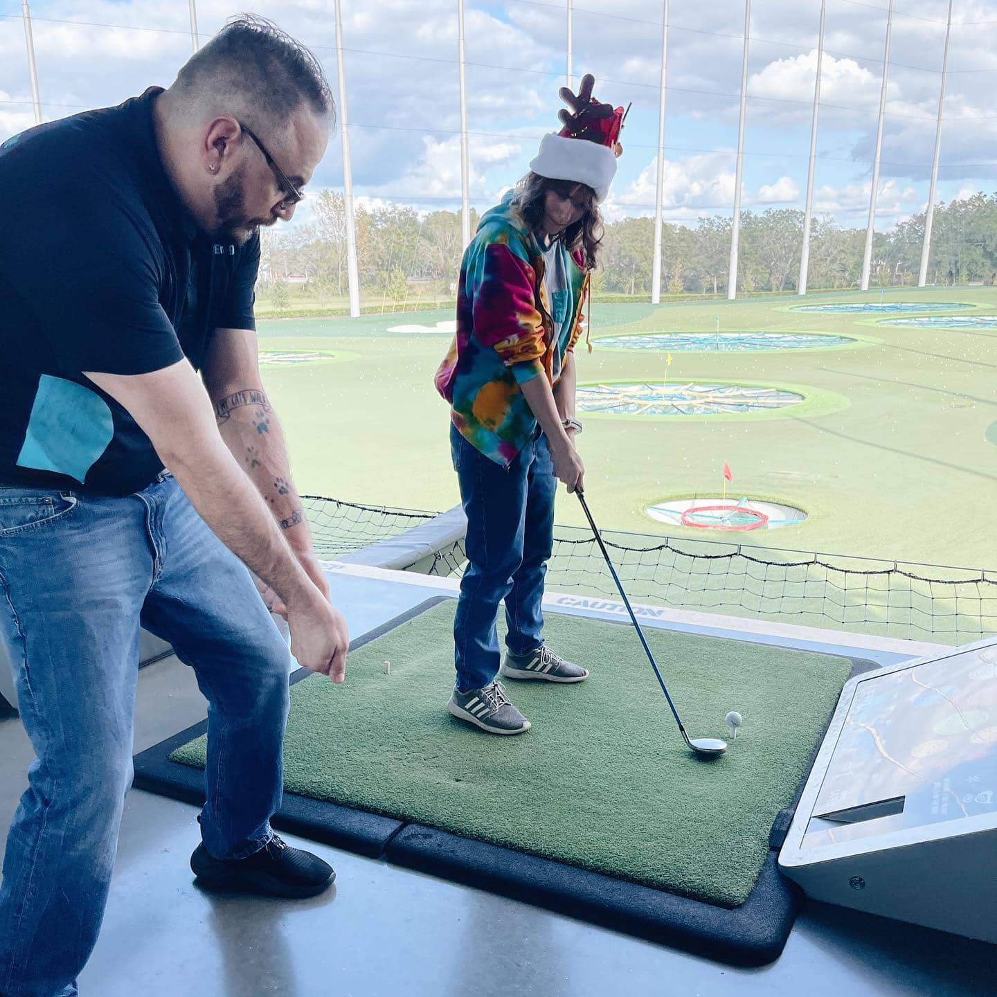ActivEngage team member learns how to golf