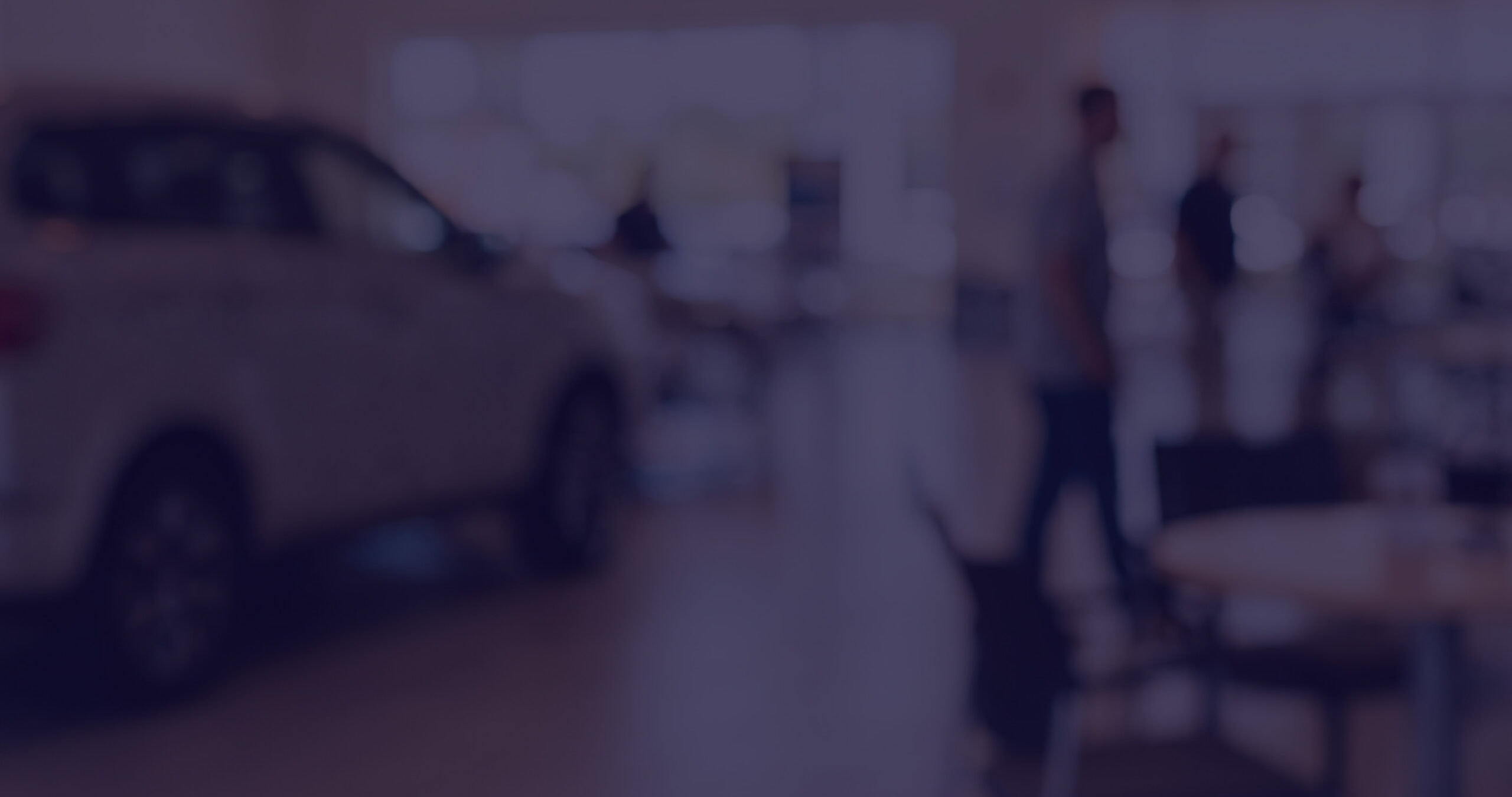 ActivEngage automotive display at a car showroom with visitors.